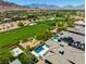 Aerial view showcasing home, pool, and golf course at 2623 Turtle Head Peak Dr, Las Vegas, NV 89135