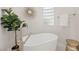 Relaxing bathroom with a freestanding tub and natural light at 2623 Turtle Head Peak Dr, Las Vegas, NV 89135