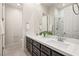 Double vanity bathroom with dark wood cabinets and quartz countertop at 2623 Turtle Head Peak Dr, Las Vegas, NV 89135