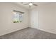 Bright bedroom with gray carpet and neutral walls at 2623 Turtle Head Peak Dr, Las Vegas, NV 89135