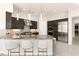 Large kitchen island with seating and granite countertop at 2623 Turtle Head Peak Dr, Las Vegas, NV 89135