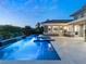 Resort-style pool and spa with water feature, at dusk at 2623 Turtle Head Peak Dr, Las Vegas, NV 89135