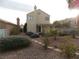 Backyard view showcasing a patio and landscaping at 2662 Churchill Cir, Henderson, NV 89074