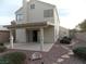 Covered patio and spacious backyard with gravel at 2662 Churchill Cir, Henderson, NV 89074