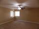 Bright bedroom with ceiling fan and large window at 2662 Churchill Cir, Henderson, NV 89074