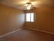 Spacious bedroom with ceiling fan and window at 2662 Churchill Cir, Henderson, NV 89074