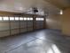 Large three car garage with high ceilings and ample storage space at 2662 Churchill Cir, Henderson, NV 89074