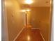 Light and airy hallway with wood flooring at 2662 Churchill Cir, Henderson, NV 89074