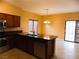 Combined kitchen and dining area with tile flooring and access to backyard at 2662 Churchill Cir, Henderson, NV 89074