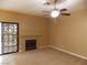 Living room with fireplace, ceiling fan and patio access at 2662 Churchill Cir, Henderson, NV 89074