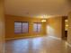 Spacious living room with tile floors and large windows at 2662 Churchill Cir, Henderson, NV 89074