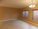 Living room with tile floors, neutral walls and window blinds at 2662 Churchill Cir, Henderson, NV 89074