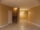 Living room with tile floors and staircase to the second floor at 2662 Churchill Cir, Henderson, NV 89074