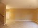 Living room with tile floors, neutral walls and a door to the hallway at 2662 Churchill Cir, Henderson, NV 89074