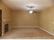 Spacious living room featuring a fireplace and ceiling fan at 2662 Churchill Cir, Henderson, NV 89074