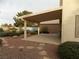 Covered patio with stone pathway and landscaping at 2662 Churchill Cir, Henderson, NV 89074