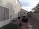 Side yard with landscaping and AC units at 2662 Churchill Cir, Henderson, NV 89074