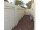 Side yard with gravel and a tall wall for privacy at 2662 Churchill Cir, Henderson, NV 89074