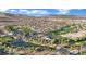 Aerial view of golf course, lake, and residential community at 295 Blackstone River Ave, Las Vegas, NV 89148