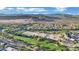 Aerial view of golf course community with scenic mountain views at 295 Blackstone River Ave, Las Vegas, NV 89148