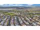 Aerial view of neighborhood near golf course and mountain range at 295 Blackstone River Ave, Las Vegas, NV 89148