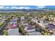 Aerial view of homes showcasing a mountain and golf course view at 295 Blackstone River Ave, Las Vegas, NV 89148