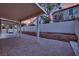 Covered patio, fire pit, and brick pavers create a relaxing backyard oasis at 295 Blackstone River Ave, Las Vegas, NV 89148