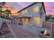 Brick patio, fire pit, pergola, and sunset view at 295 Blackstone River Ave, Las Vegas, NV 89148