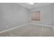 Carpeted bedroom with neutral walls and a window at 295 Blackstone River Ave, Las Vegas, NV 89148