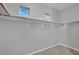 Spacious walk-in closet with double rods and overhead shelving at 295 Blackstone River Ave, Las Vegas, NV 89148