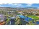 Aerial view of gated community entrance with lake and golf course at 295 Blackstone River Ave, Las Vegas, NV 89148