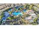 Aerial view of community pool, tennis courts, and playground at 295 Blackstone River Ave, Las Vegas, NV 89148