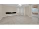 Gathering room with tile floors, built-in shelving and backyard access at 295 Blackstone River Ave, Las Vegas, NV 89148