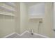 Laundry room with washer/dryer hookups and built-in shelving at 295 Blackstone River Ave, Las Vegas, NV 89148