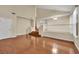 High-ceiling living room with hardwood floors and staircase at 295 Blackstone River Ave, Las Vegas, NV 89148