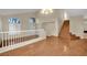 Spacious living room with hardwood floors and staircase at 295 Blackstone River Ave, Las Vegas, NV 89148