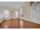 Living room with hardwood floors and large windows at 295 Blackstone River Ave, Las Vegas, NV 89148