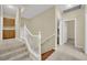 Upstairs hallway with wooden staircase and storage cabinets at 295 Blackstone River Ave, Las Vegas, NV 89148