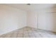 Simple bedroom with tile floors and neutral walls at 3017 Saint George St # B, North Las Vegas, NV 89030