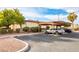 Carport with two cars parked underneath and landscaping at 3017 Saint George St # B, North Las Vegas, NV 89030