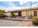 Tan colored exterior of building with carport and landscaping at 3017 Saint George St # B, North Las Vegas, NV 89030