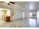 Open concept kitchen with granite counters and wood cabinets at 3017 Saint George St # B, North Las Vegas, NV 89030