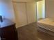 Second bedroom with a double bed and sliding closet doors at 307 E Van Wagenen St, Henderson, NV 89015