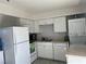 Well-equipped kitchen with white cabinetry and appliances at 307 E Van Wagenen St, Henderson, NV 89015