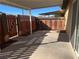 Private patio area with covered seating and wood fence at 307 E Van Wagenen St, Henderson, NV 89015