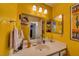 Bathroom with a vanity, mirror, and yellow walls at 3550 Bay Sands Dr # 2051, Laughlin, NV 89029