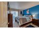 Spacious bedroom with a king-size bed and blue accent wall at 3550 Bay Sands Dr # 2051, Laughlin, NV 89029