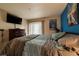 Spacious bedroom with a comfortable bed and mounted TV at 3550 Bay Sands Dr # 2051, Laughlin, NV 89029