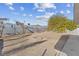 Large backyard with a fire pit and mature plants at 4027 Boratko St, Las Vegas, NV 89115