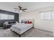 Spacious bedroom with a comfortable bed and a gray couch at 4027 Boratko St, Las Vegas, NV 89115